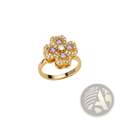 A gold-toned rotating zircon four leaf clover adjustable ring with purple and clear gemstones in a flower shape