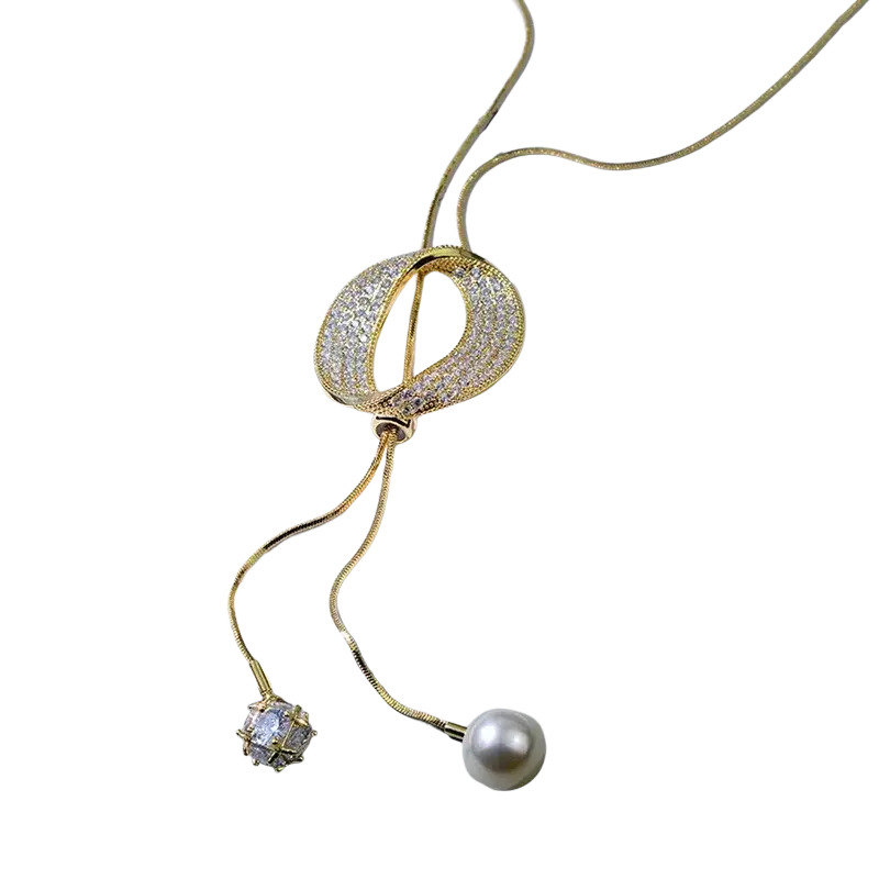Gold-toned round circle pendant necklace with diamond-encrusted knot and crystal and pearl charms for women