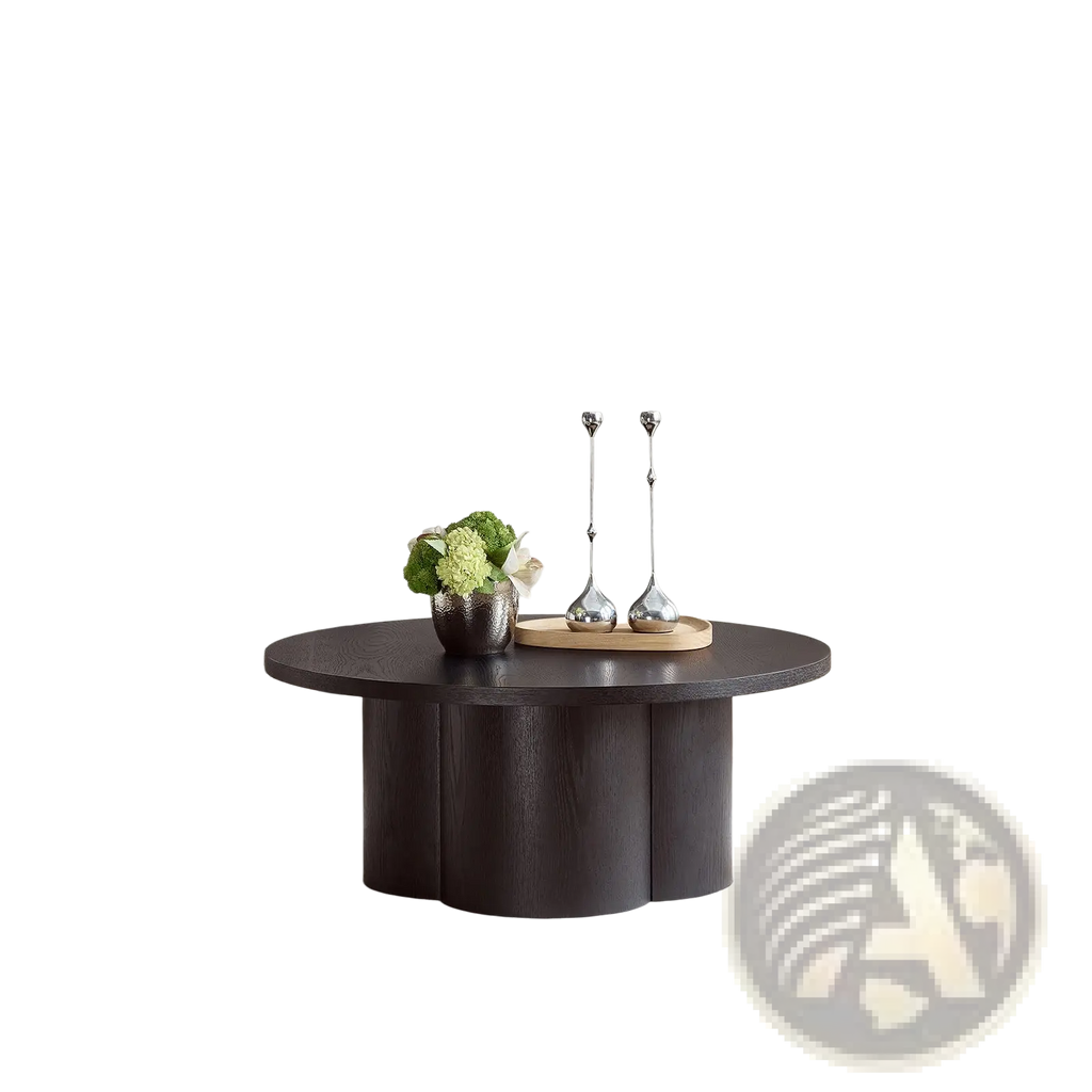 Round coffee table in dark wood with a smooth circular top and modern sculpted base for accent use