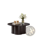 Round coffee table in dark wood with a unique sculpted base and smooth matte finish for modern accent use