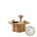 Round coffee table with light natural wood finish and three cylindrical legs featuring a modern pedestal base