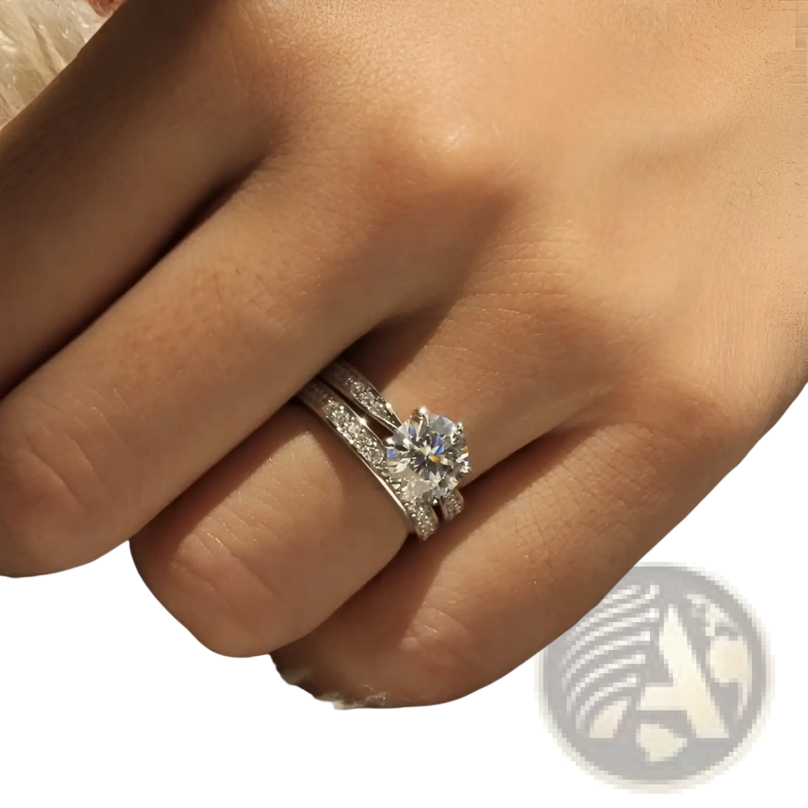 A sparkling round cut zircon wedding ring set in white gold finish with pavé side stones worn on a finger