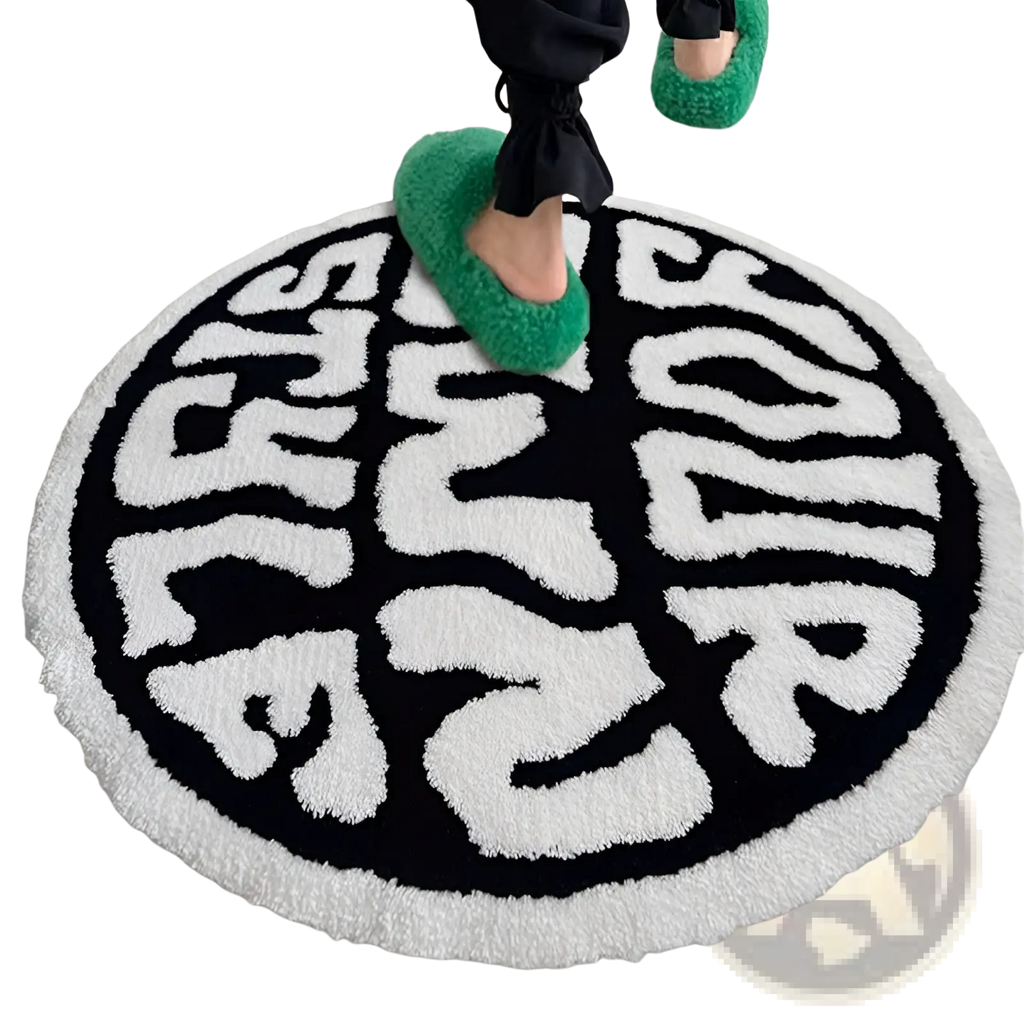Round plush black and white rug with bold minimalist lettering your made of soft plush material for indoor living spaces