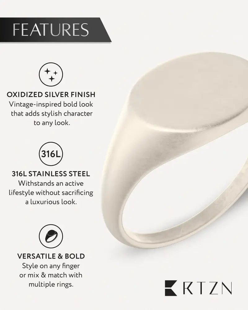 A sleek oxidized round signet ring in silver crafted from durable 316l stainless steel with a minimalist design
