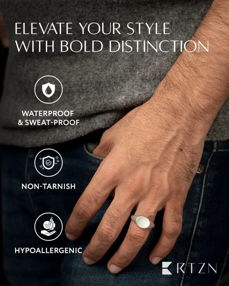Silver oxidized round signet ring with smooth oval face in 316l stainless steel featuring minimalist design