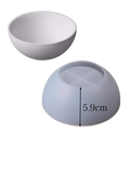 White silicone round mold with smooth exterior and cross-shaped dividers for concrete bowls and candles