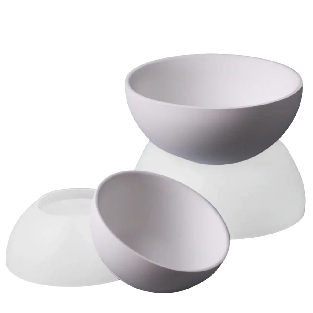 White ceramic bowls with smooth rounded edges made using round silicone mold for concrete storage bowls and candles