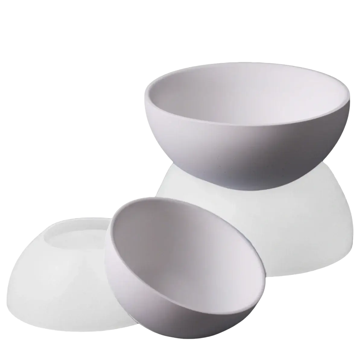 White ceramic bowls with smooth rounded edges made using round silicone mold for concrete storage bowls and candles