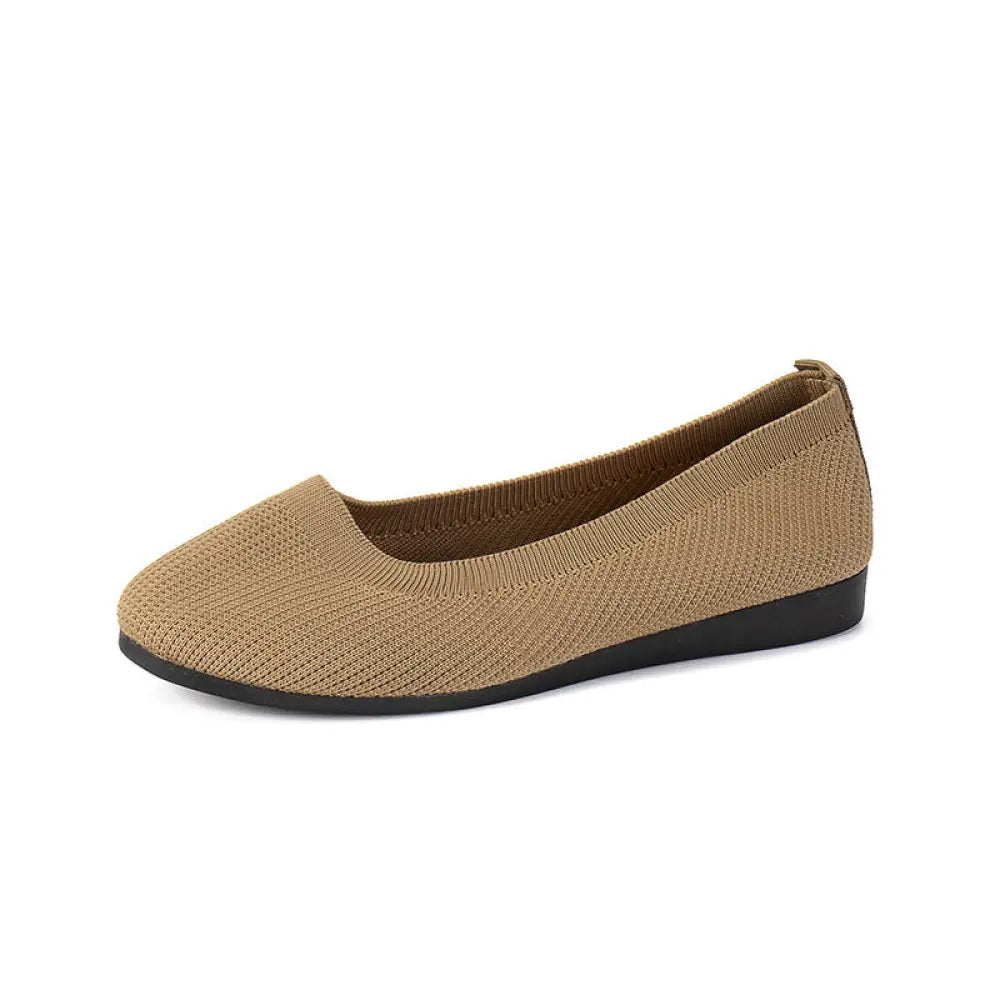 Women’s tan knit mesh slip on flats with round toe and black rubber sole for comfortable everyday wear