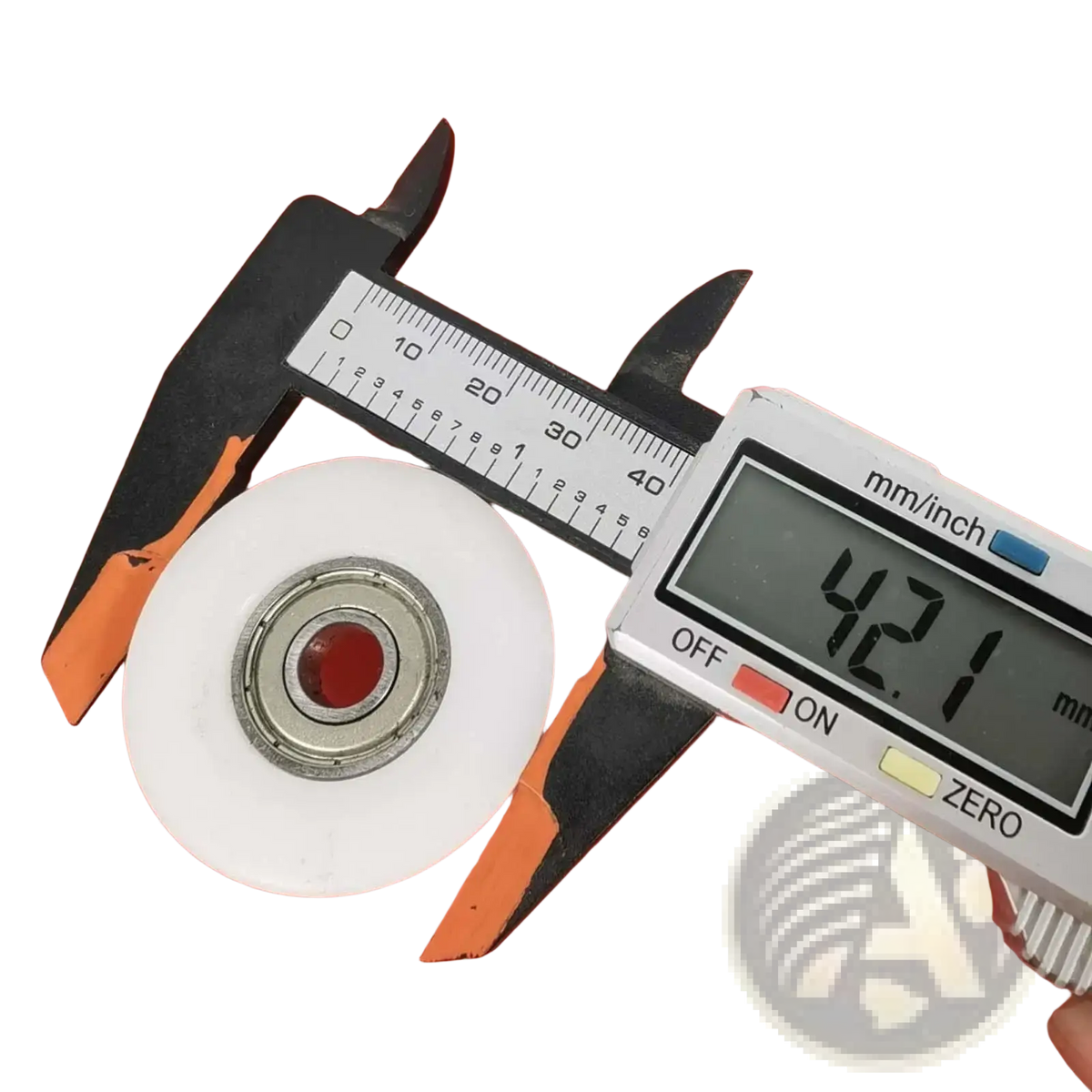 White plastic rowing machine bearing pulley wheel replacement with metallic center bearing held in black and orange calipers