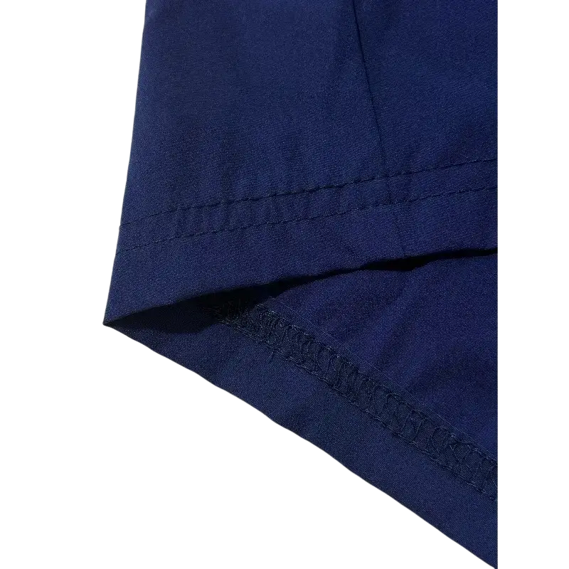 Deep navy blue royal blue athletic shorts with drawstring pockets and neat matching thread stitching along the hem