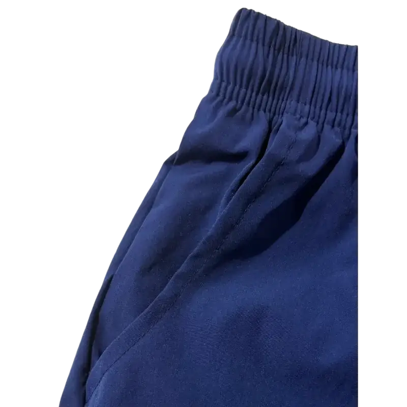 Royal blue athletic shorts in soft fabric with elastic waistband drawstring and pockets for comfortable wear
