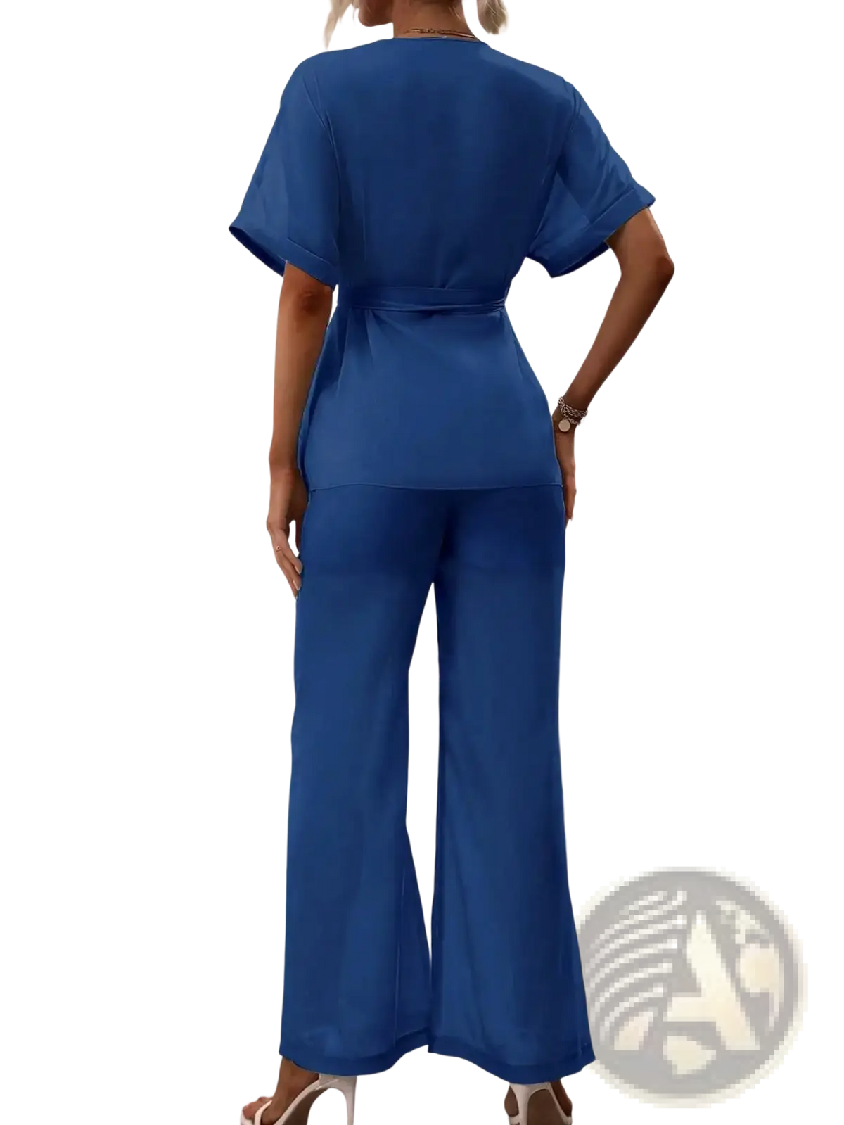 A vibrant royal blue satin two piece outfit with a belted short sleeve top and wide leg trousers