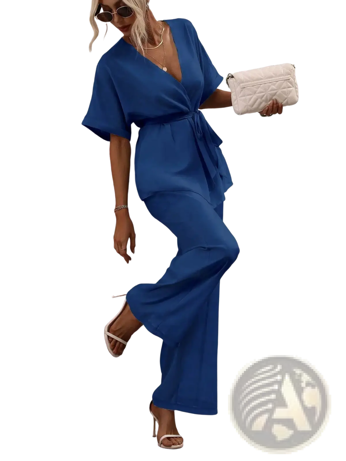 A vibrant royal blue satin wrap-style jumpsuit with v-neckline, short flutter sleeves, and wide-leg pants