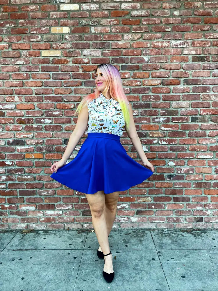 Vibrant royal blue retro a-line skater skirt with pockets made from soft flared fabric for stylish casual wear