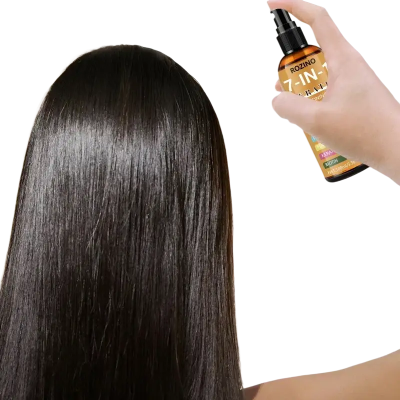 A sleek amber glass bottle of rozino 7-in-1 keratin hair spray with black nozzle and natural plant seed oils highlights