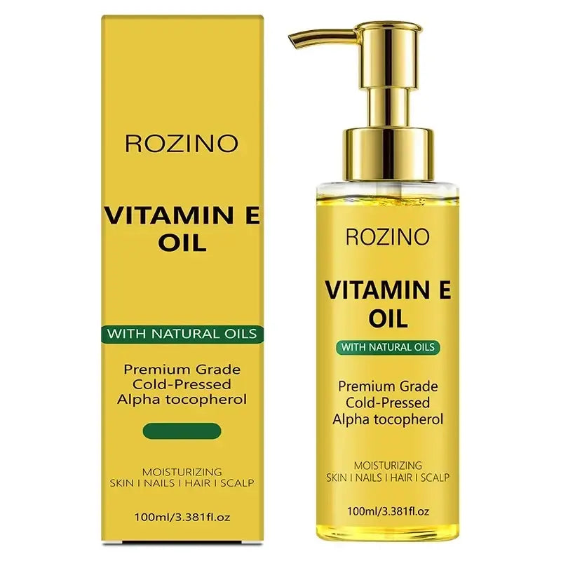 Gold pump bottle and yellow box of Rozino vitamin e care oil with clear glass body to soften dry skin