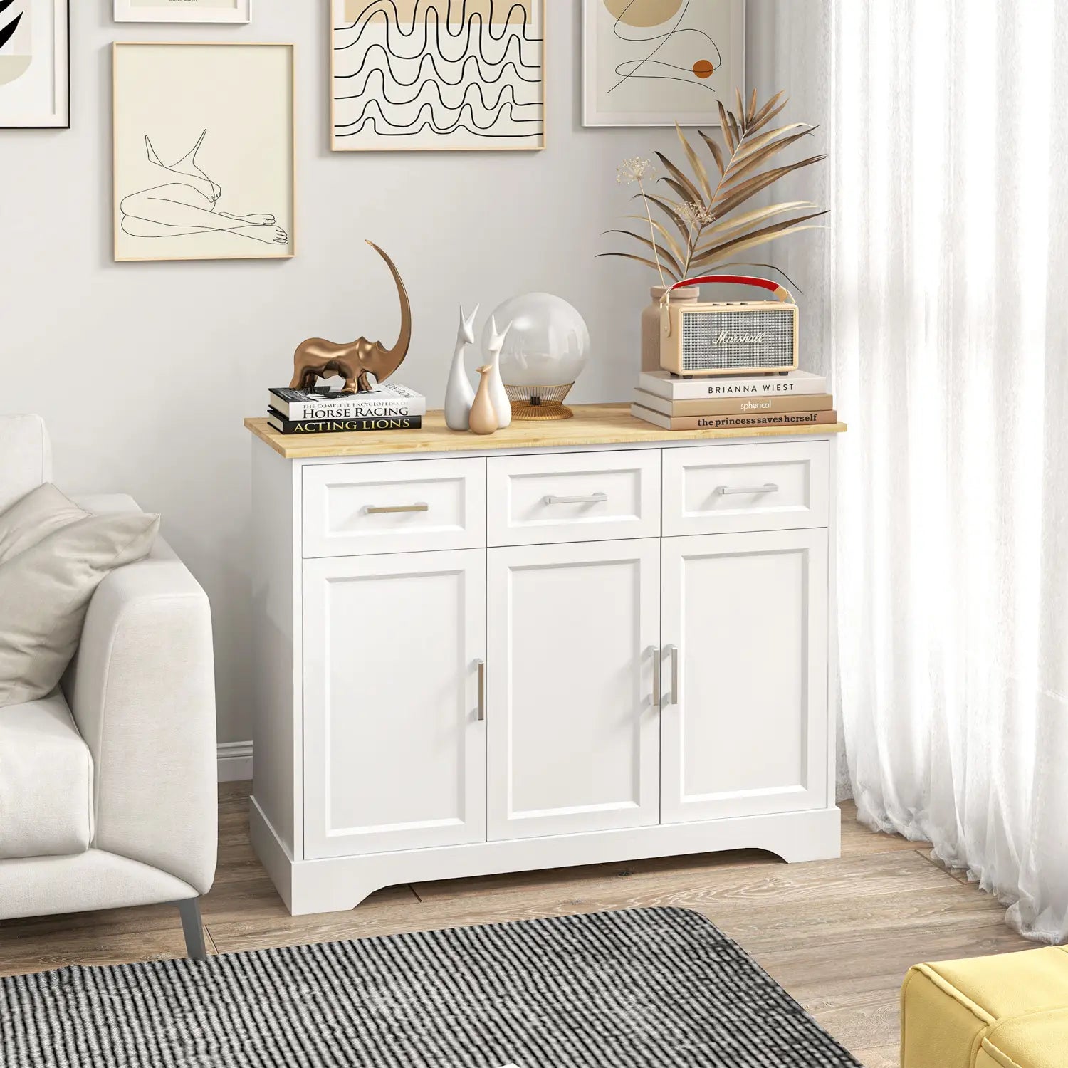 Kitchen sideboard buffet cabinet with storage white oak featuring a white wooden body with a light wood top and three drawers above two cabinet doors with simple silver handles.