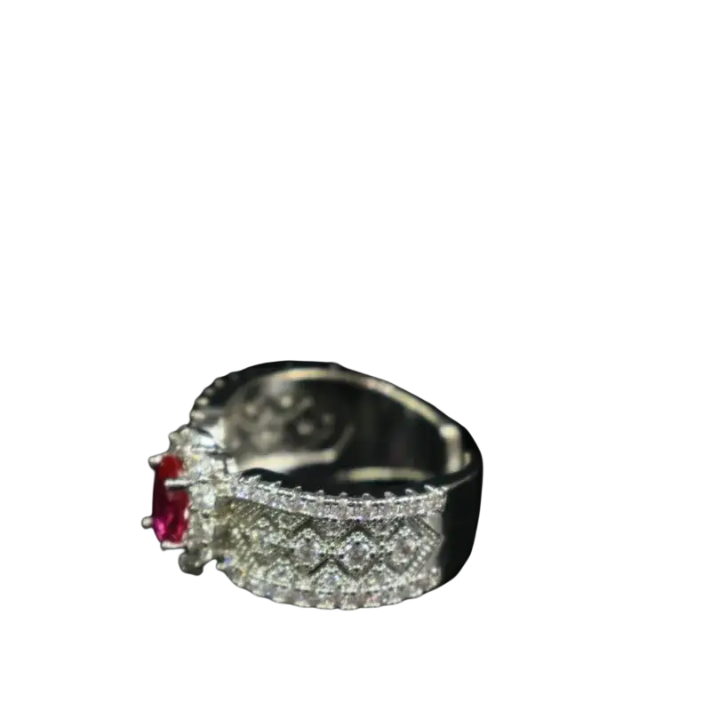 A silver ruby halo ring with a prominent red ruby center and diamond pavé geometric band