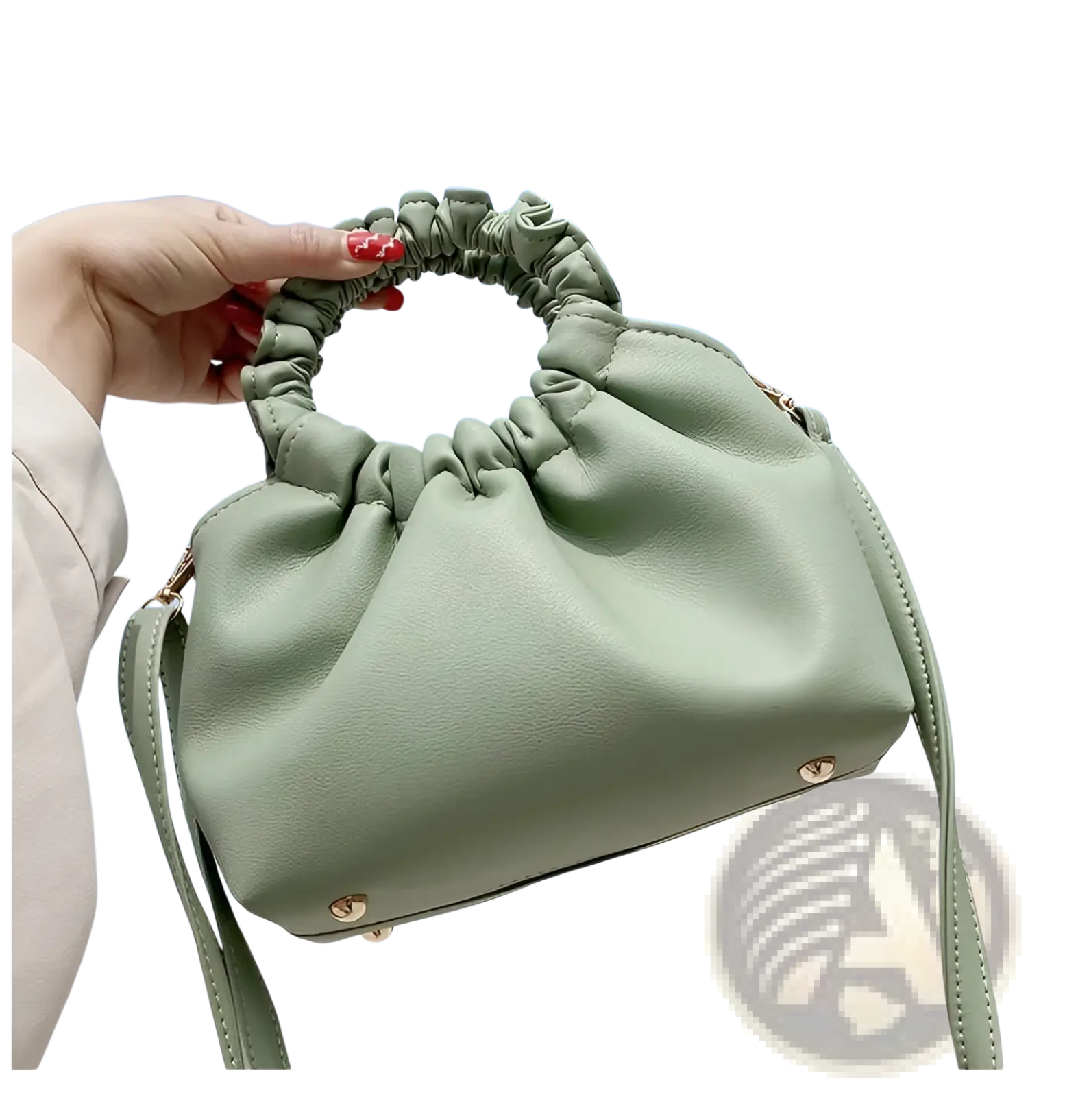 Ruched leather bucket bag in soft sage green with gathered elastic top handle and adjustable matching strap