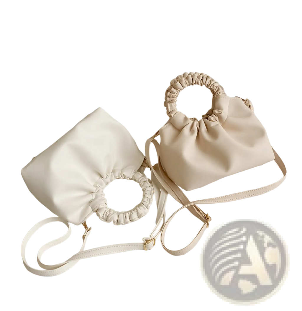 Cream-colored faux leather ruched leather bucket bag with gathered top handle and adjustable shoulder strap