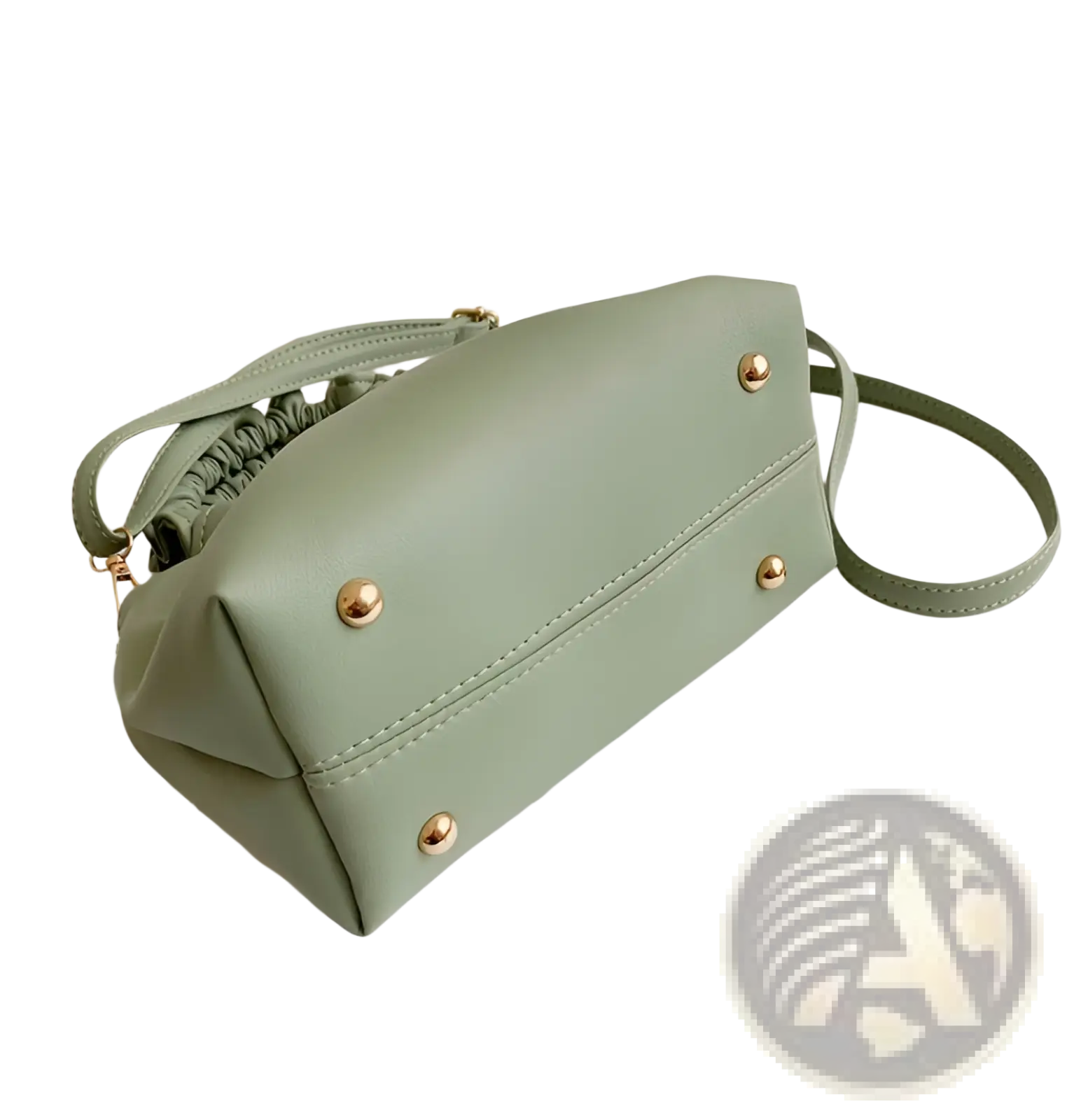 A mint green ruched faux leather bucket bag with gold-tone studs and an adjustable drawstring strap closure