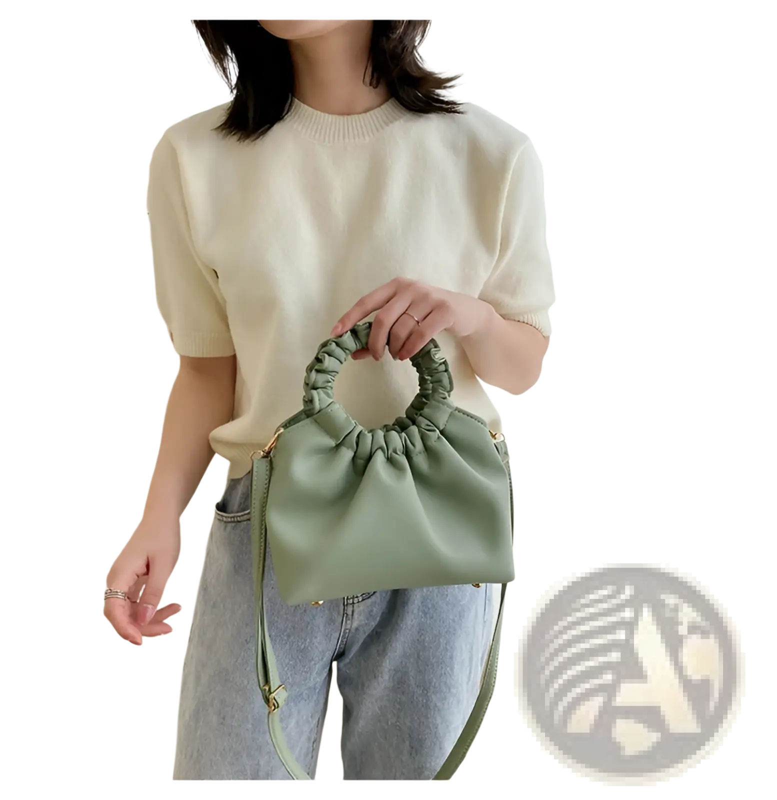A soft sage green ruched leather bucket bag with gathered elasticated top handle and adjustable strap