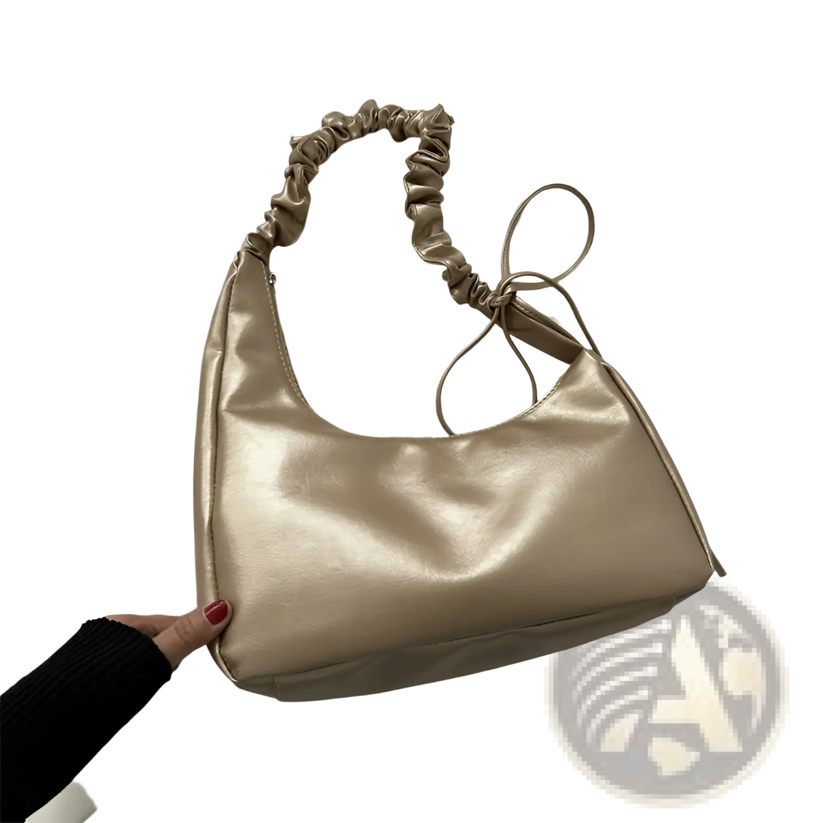 A sleek metallic gold ruched shoulder bag made of patent leather with a subtle sheen and ruched strap