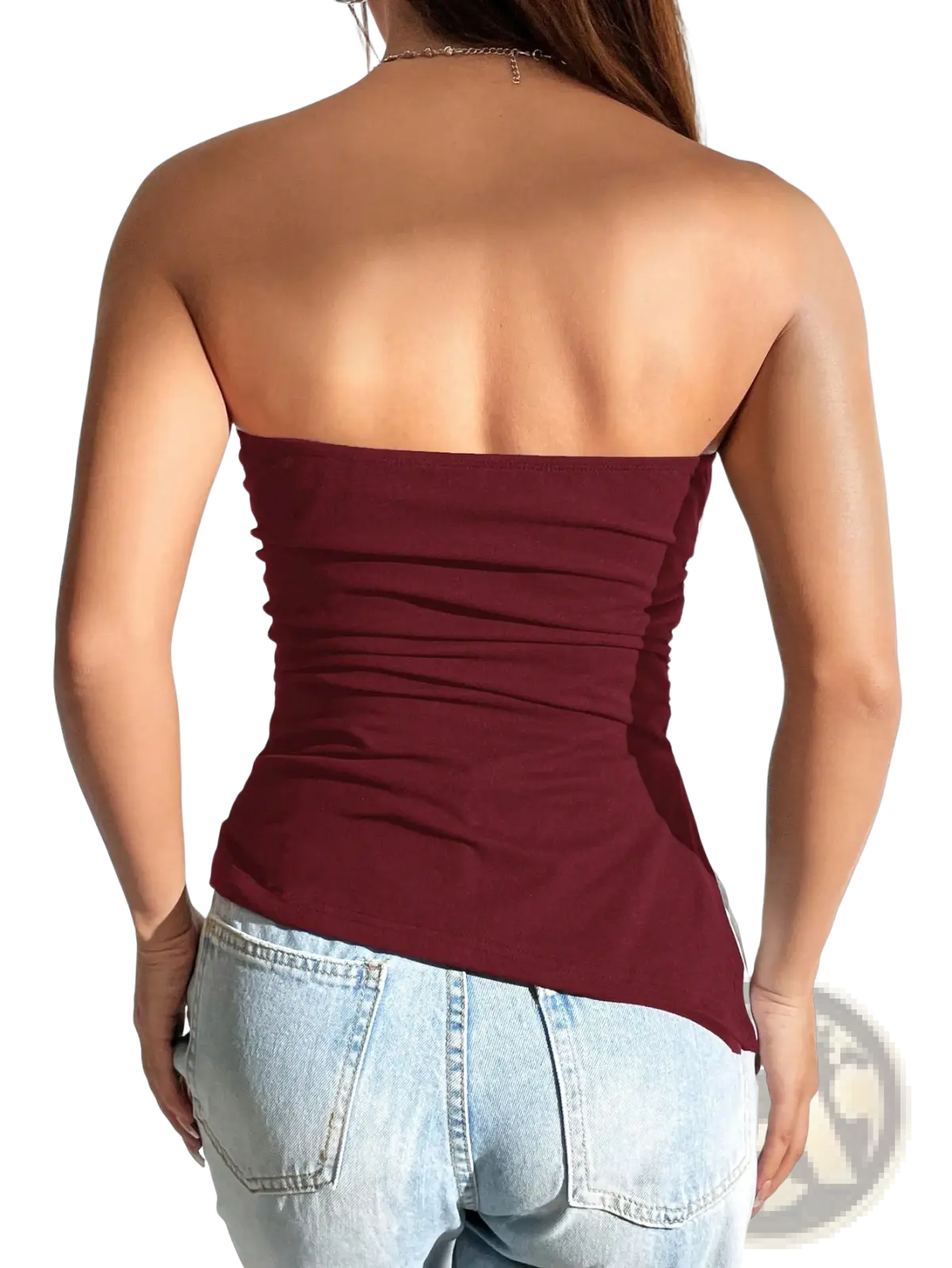 A maroon fitted strapless ruched cami top shown from the back with an asymmetrical hemline