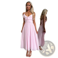 A flowing light pink sleeveless midi dress with delicate ruffled straps and a gathered waistline for vacation wear