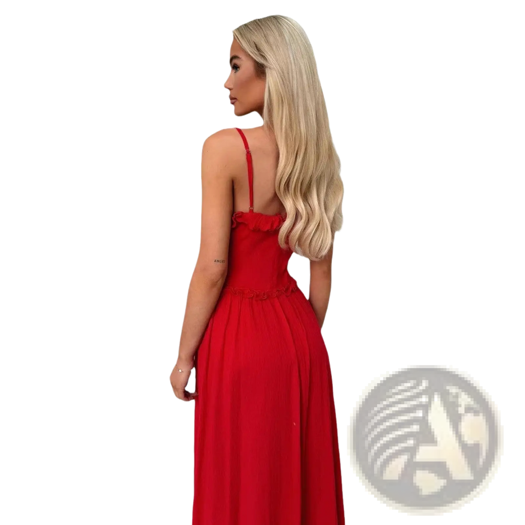 A vibrant red sleeveless flowing maxi vacation dress with thin straps and a ruffled neckline