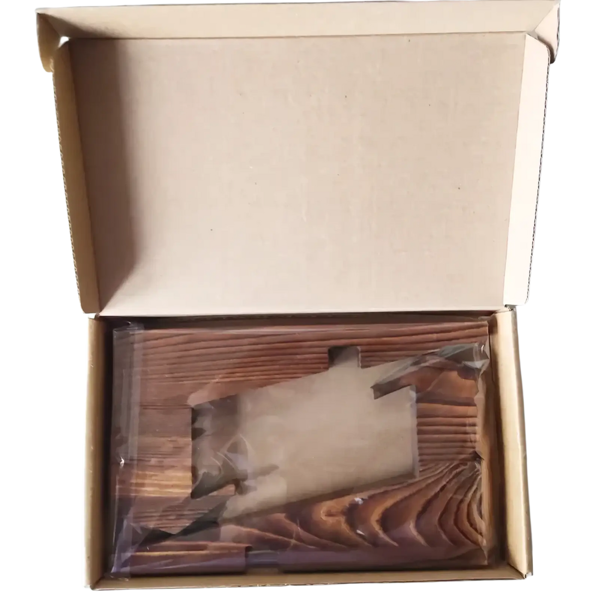 Rustic wooden cookbook stand and tablet holder made of brown wooden planks with visible grain pattern in packaging