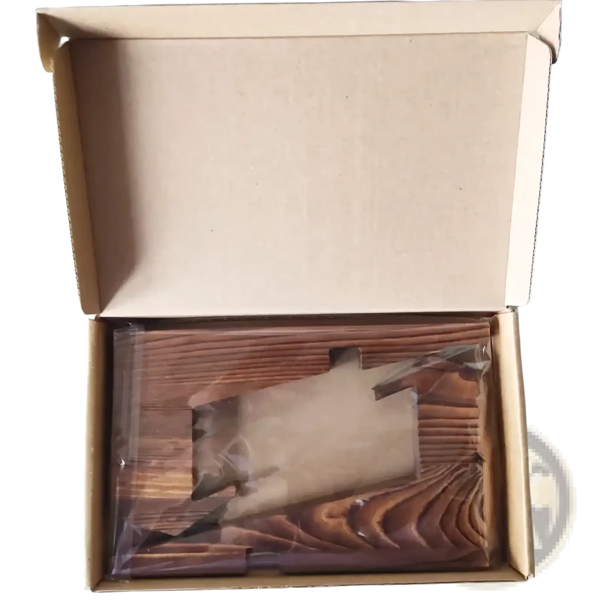 Rustic wooden cookbook stand and tablet holder made of brown wooden planks with visible grain pattern in packaging