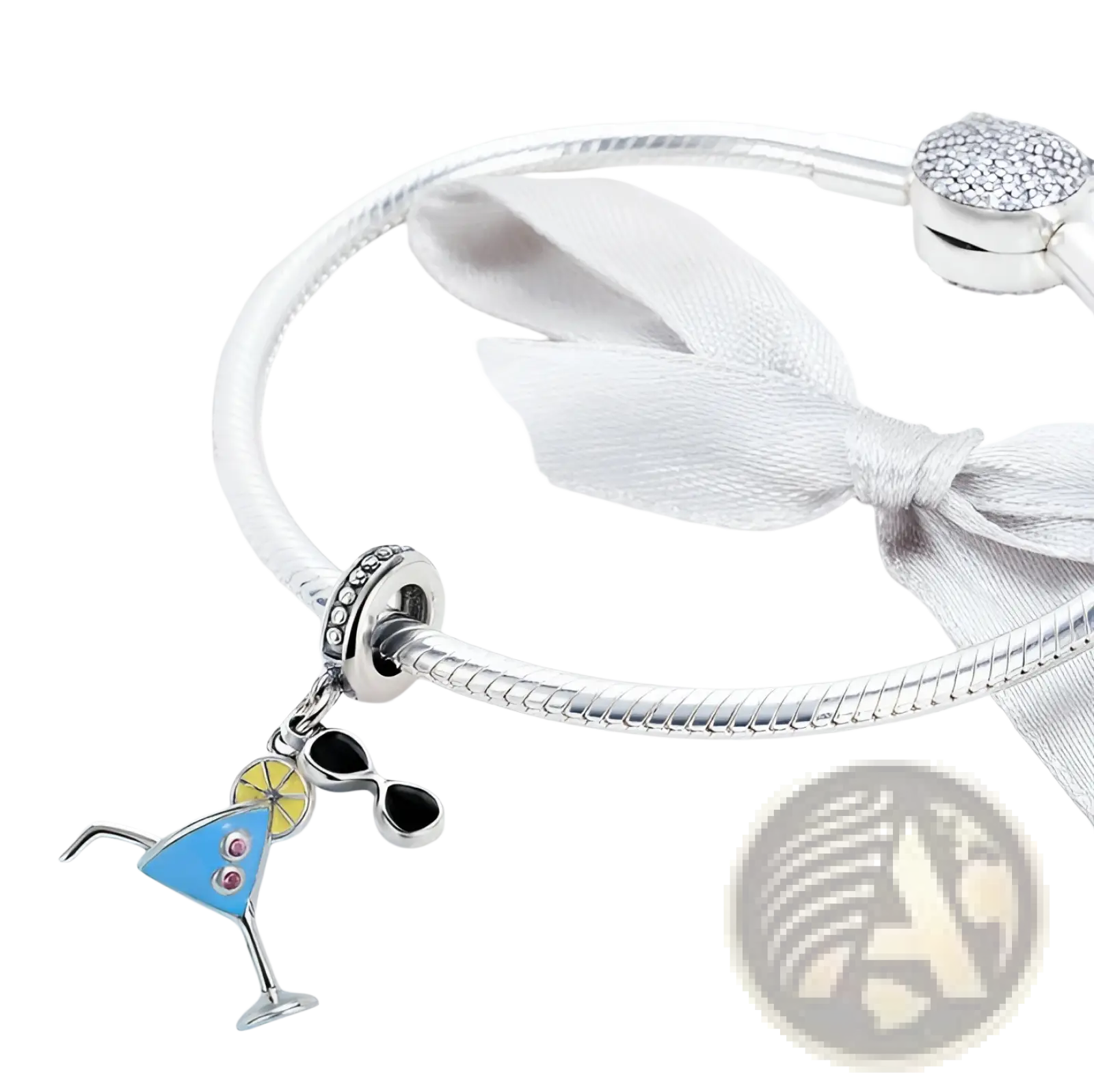 A vibrant blue enamel s925 sterling silver summer cocktail charm with yellow lemon and pink gemstones on a bracelet