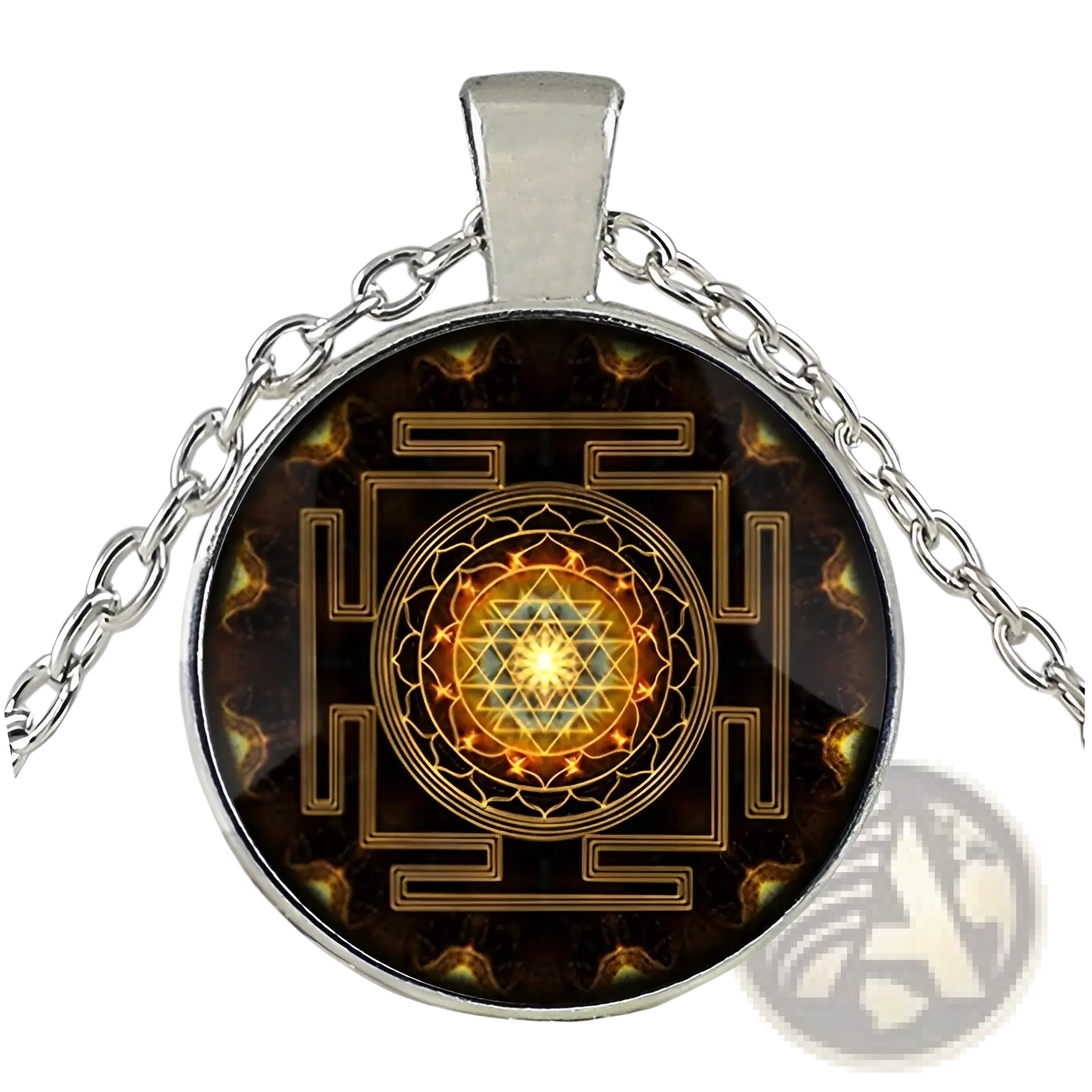 Silver-toned pendant necklace with circular glass cabochon featuring intricate golden sri yantra design on dark background