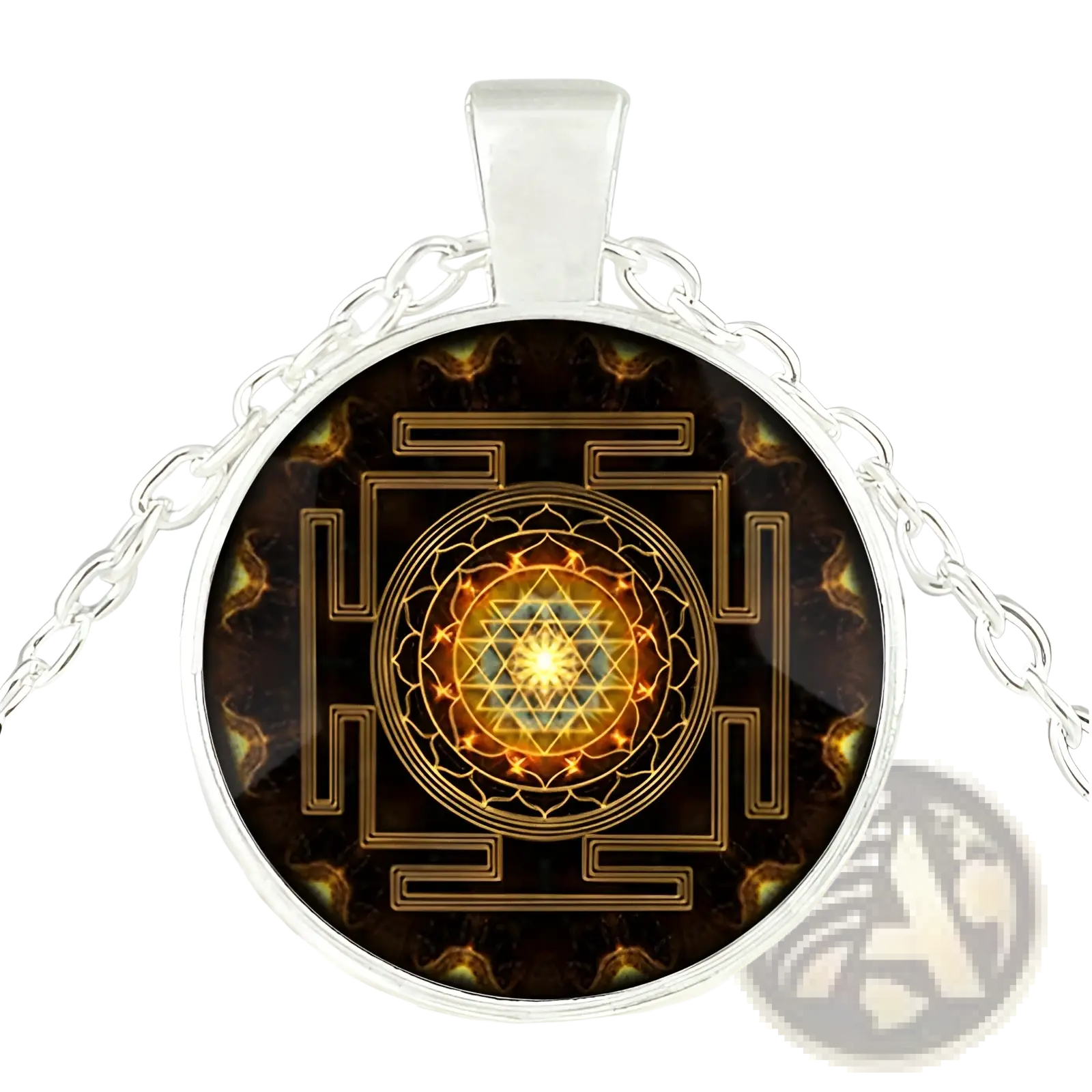 Silver-toned pendant necklace with circular glass cabochon featuring golden sri yantra design on dark background