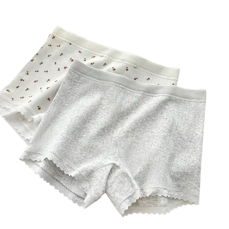 White ribbed cotton safety short pants with delicate scalloped edges and subtle floral embroidery for comfort