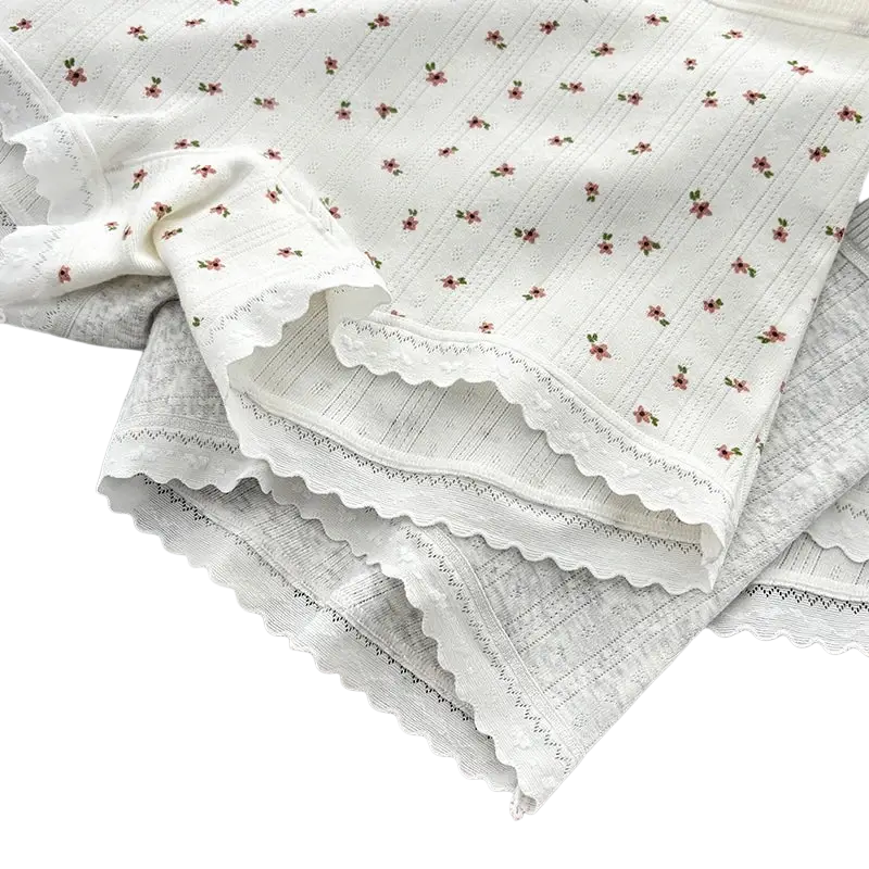 White cotton safety short pants with delicate pink floral prints and scalloped lace trim for boys
