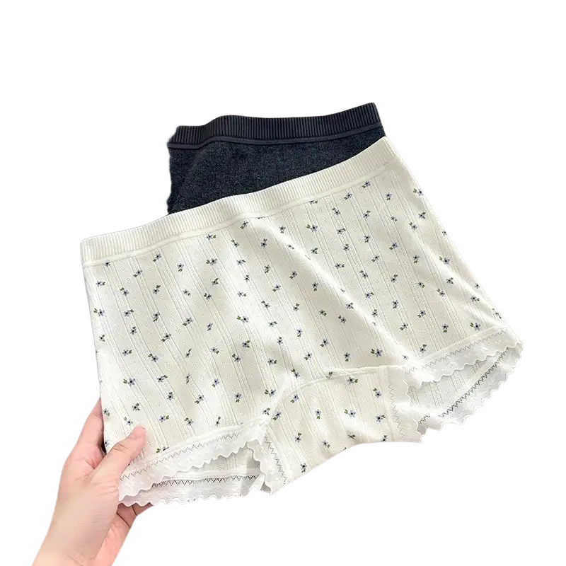 White lace-trimmed safety short pants with subtle black floral pattern and ribbed waistband in cotton boyshort style