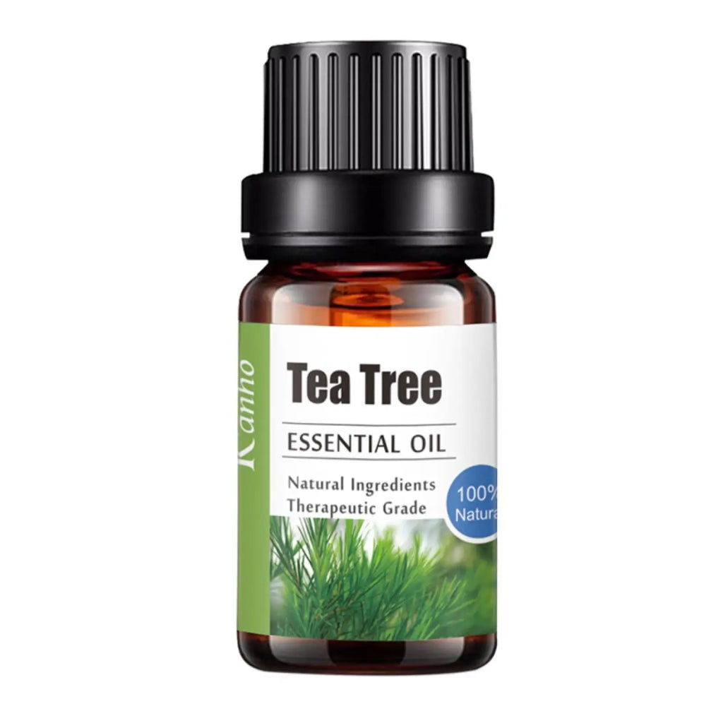 A small amber glass bottle with black ribbed cap and white label with green accents of kanno tea tree essential oil