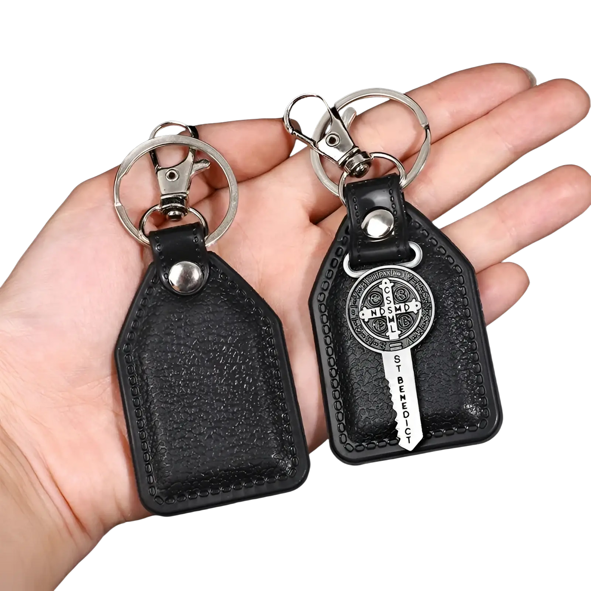 Black leather Saint Christopher keychain with silver-toned metal clasp and antique bronze finish