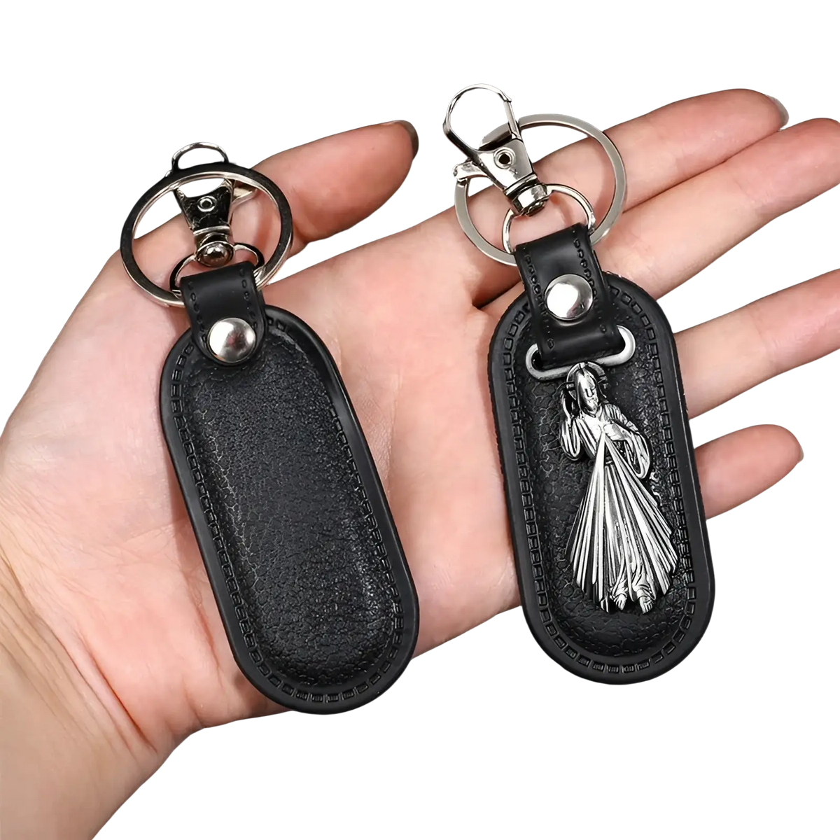 Black leather Saint Christopher keychain with silver metal charm depicting a robed figure in antique bronze finish