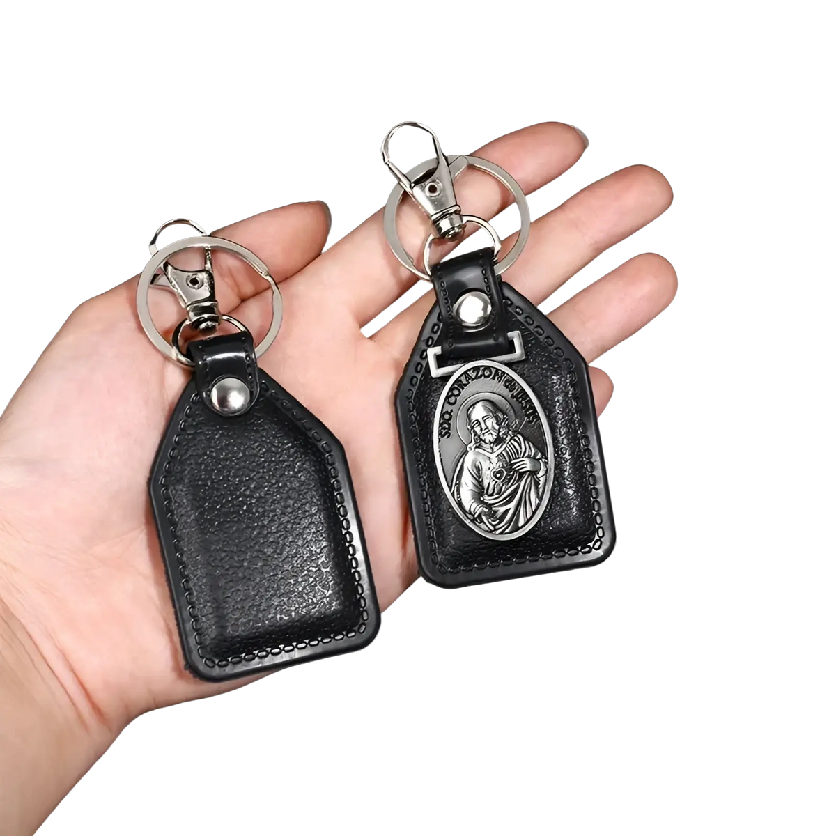 Black leather saint christopher keychain with silver-toned religious medallion and antique bronze details