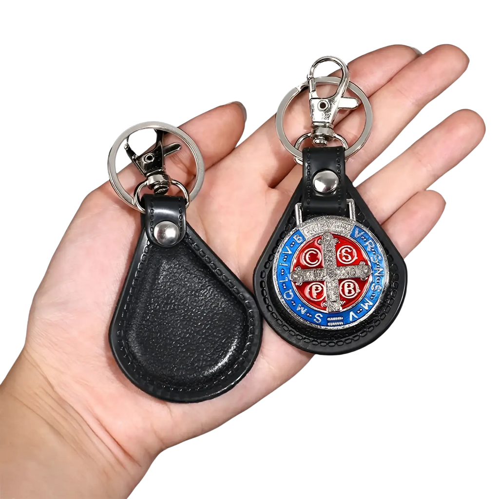 Black leather Saint Christopher keychain with silver clasp and circular red blue silver emblem in antique bronze style