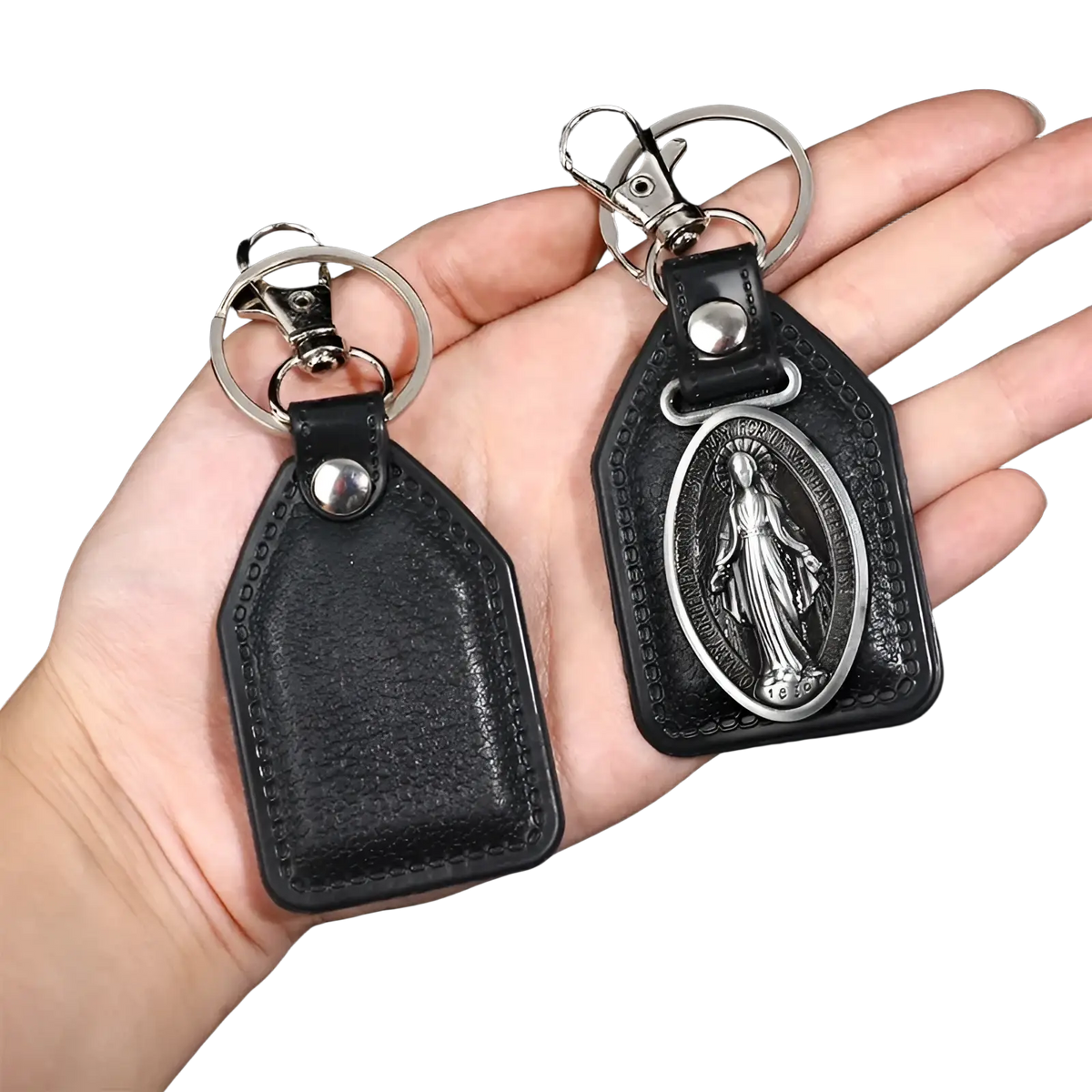 Saint Christopher leather keychain in black with silver-toned clasp and oval medallion featuring a religious figure
