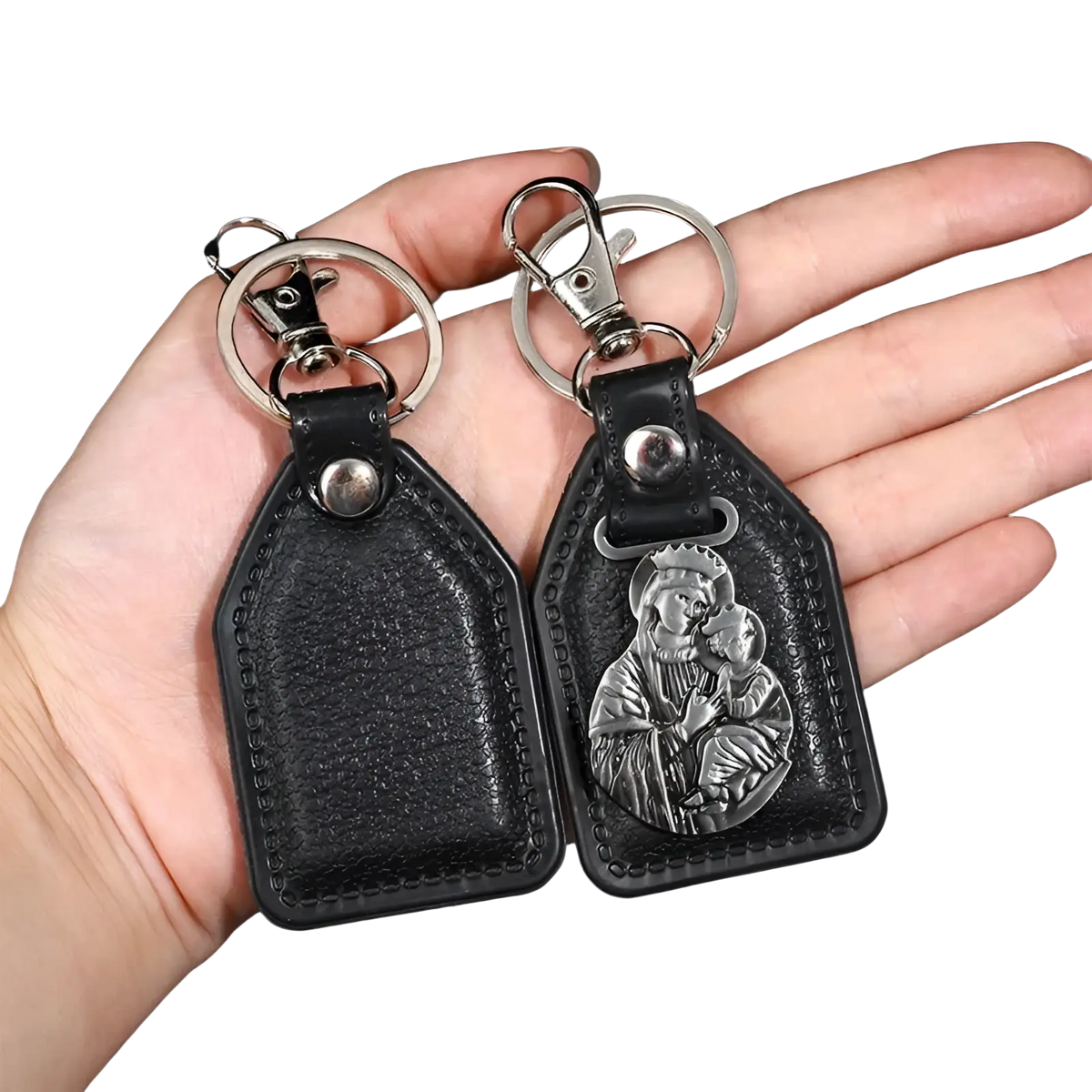 Black leather saint christopher keychain with silver toned religious medallion in antique bronze finish