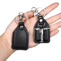 Black leather saint christopher keychain with silver toned metal jesus christ pendant and antique bronze details