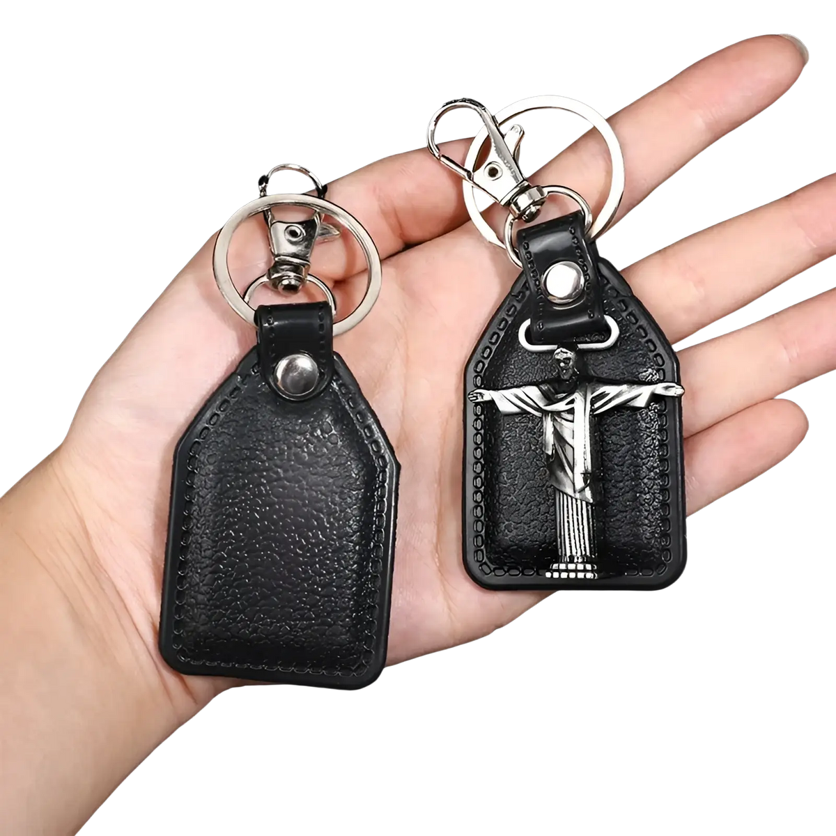Black leather saint christopher keychain with silver toned metal jesus christ pendant and antique bronze details