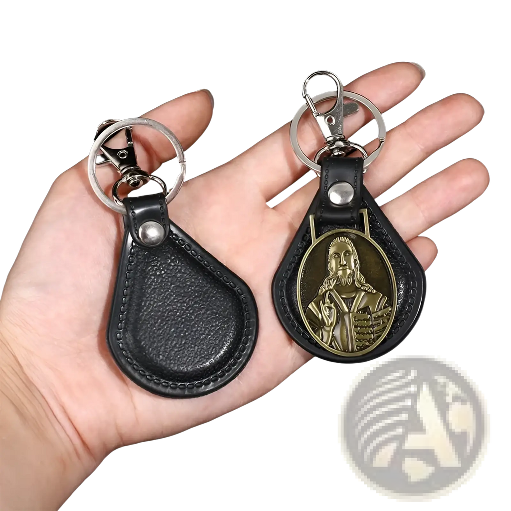 Black leather Saint Christopher keychain with silver metal clasp and gold-tone religious oval medallion antique bronze finish