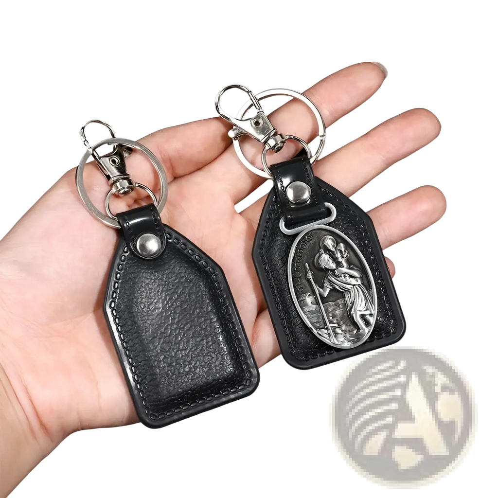 Saint Christopher leather keychain in black with silver-toned clasp and oval bronze medallion depicting saint christopher